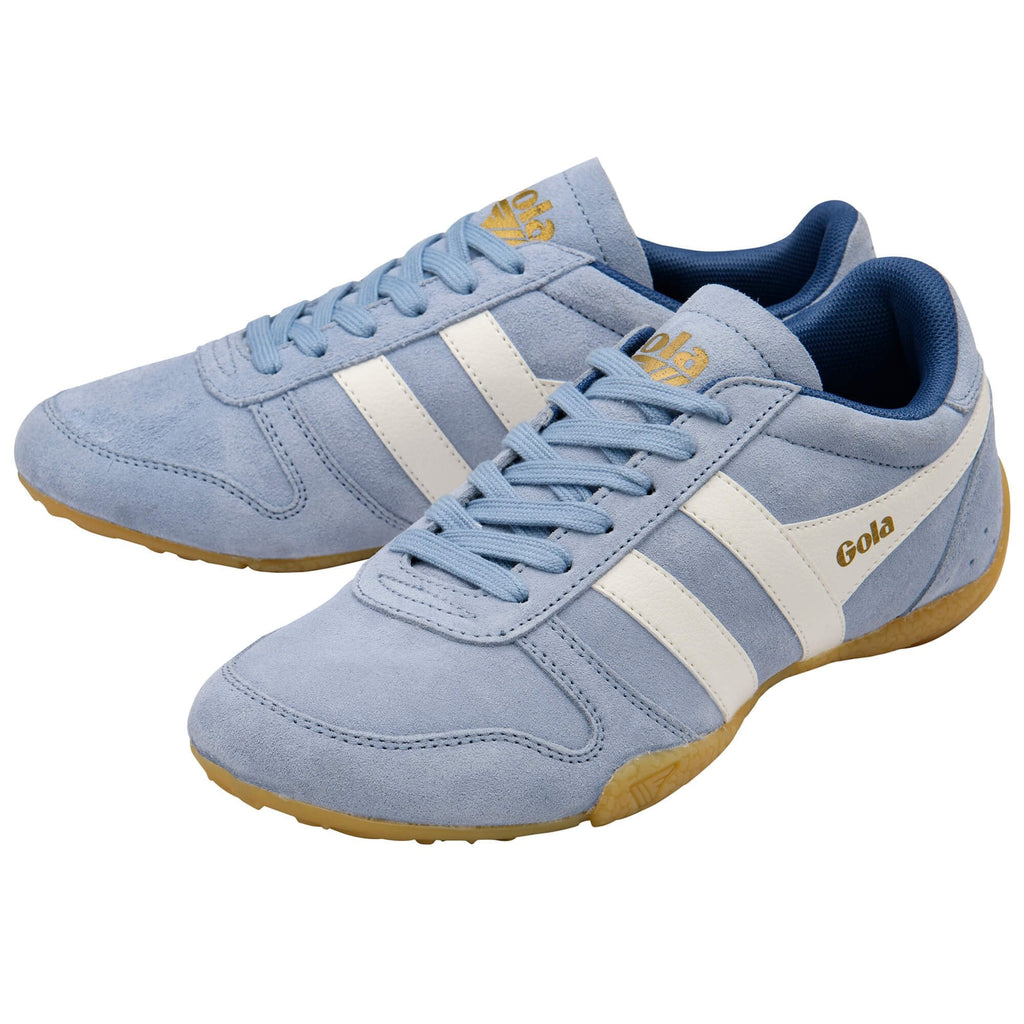 Pair of blue Gola trainers with white stripes and gold accents on a white background