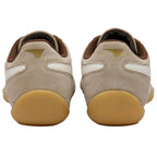 Pair of beige Gola trainers with brown lining on a white background