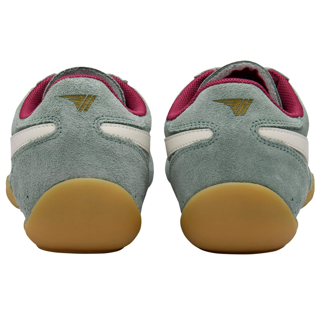 Pair of green Gola trainers with red accents and brown soles on a white background