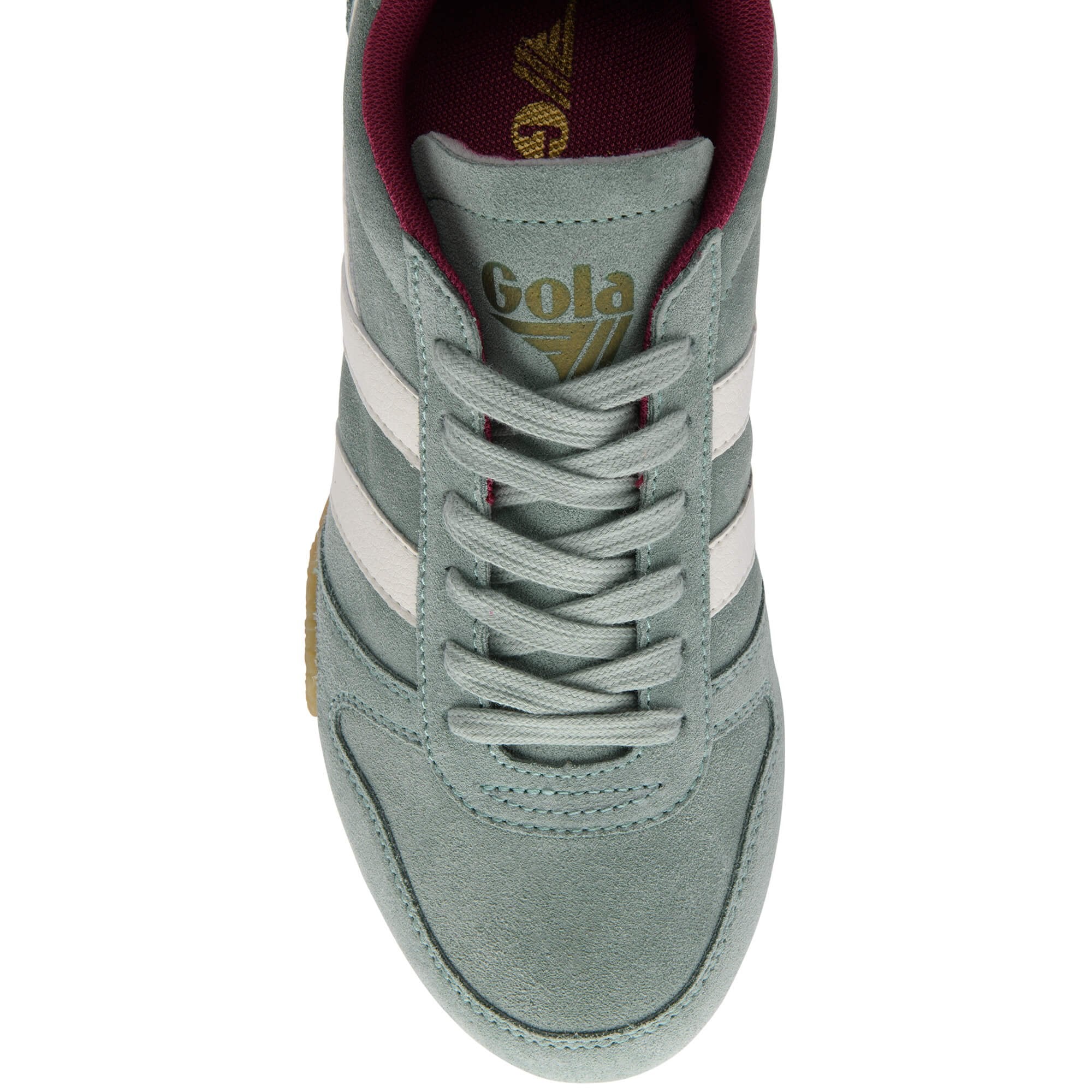 Green Gola trainer with white stripes on a white background