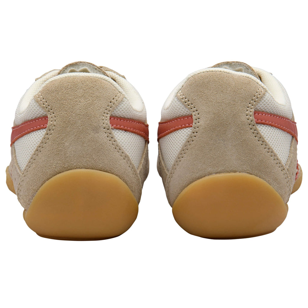 Pair of beige and white trainers with red stripes and gum soles, seen from the back