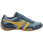 Blue and yellow trainer with brown sole on a white background