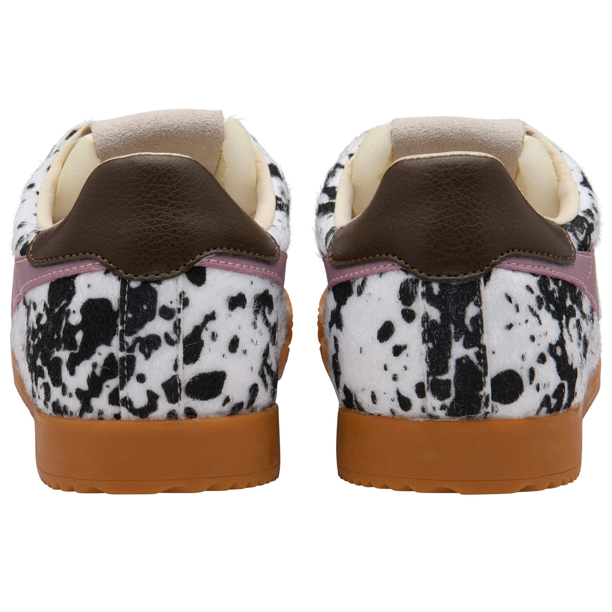Pair of trainers with animal print upper and gum soles on a white background