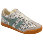 Trainer with spotted pattern and green accents on a white background