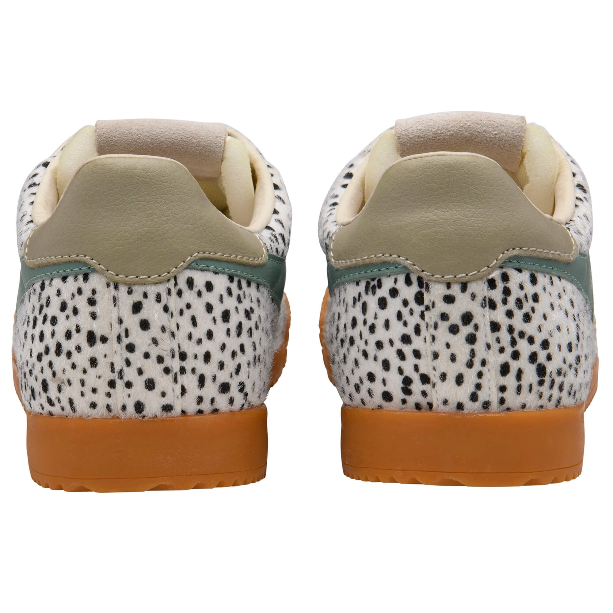 Pair of trainers with animal print pattern and brown sole on a white background