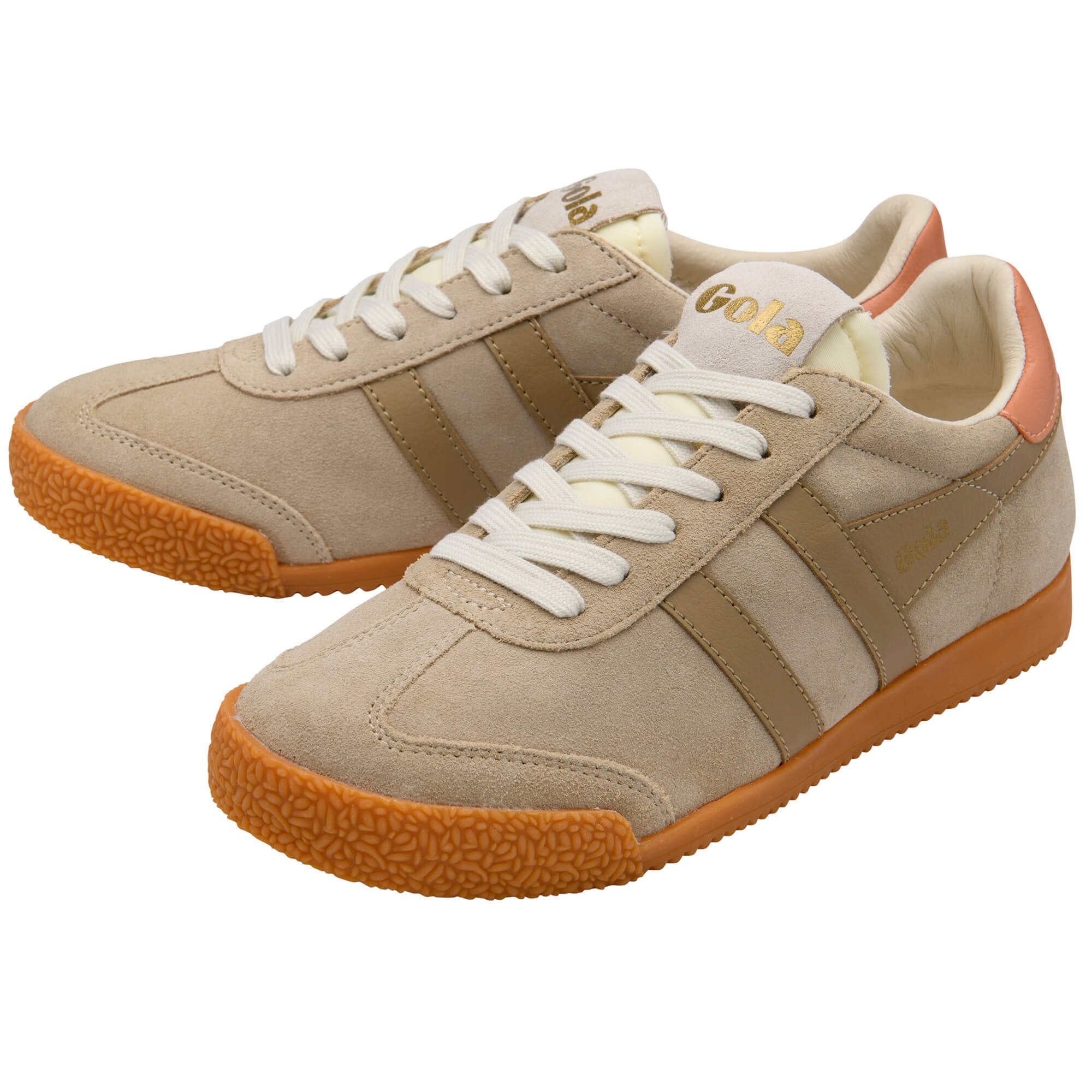 Pair of Gola trainers in beige with tan stripes and gum soles on a white background