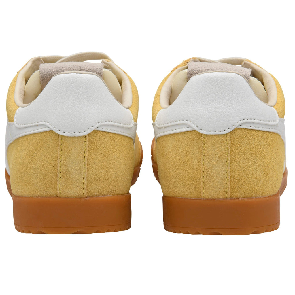 Pair of yellow Gola trainers with white accents and gum soles on a white background