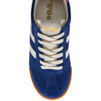 Blue Gola trainer with white stripes and laces, gold Gola logo on tongue, and gum sole on a white background