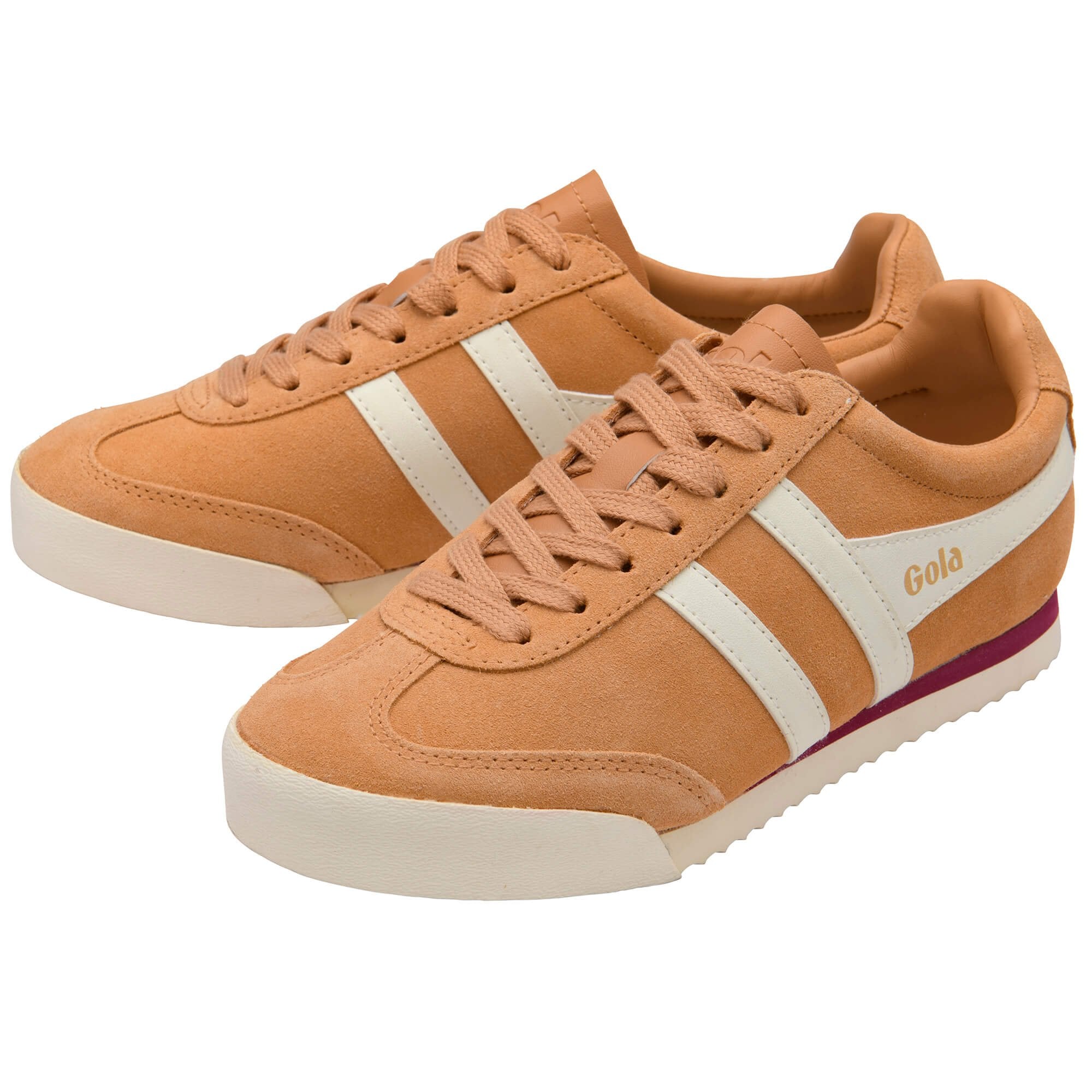 Pair of tan trainers with white stripes on a white background