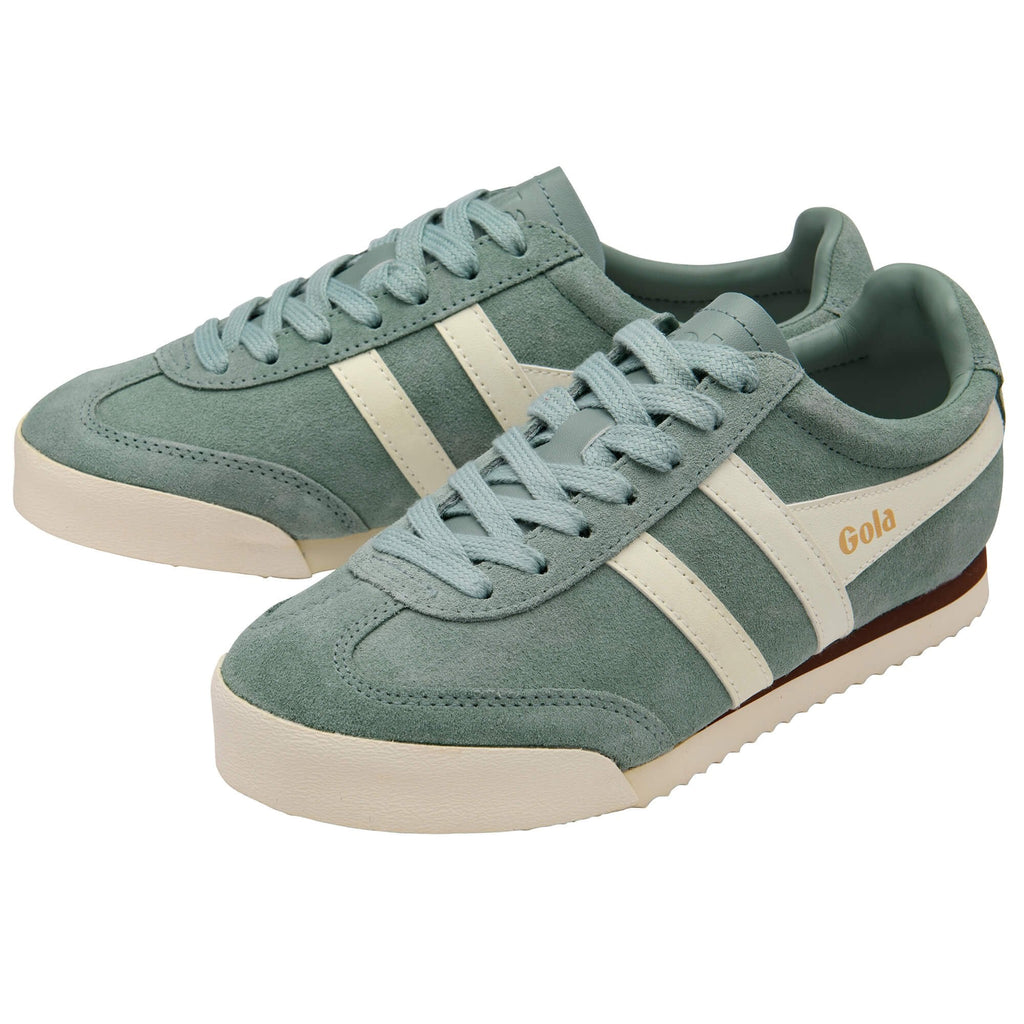Pair of green Gola trainers with white stripes on a white background