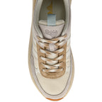 Beige trainer with brown laces on a white background
