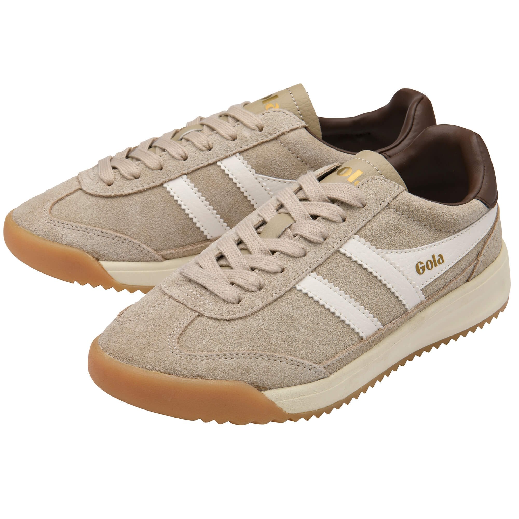 Pair of beige trainers with white stripes and brown soles on a white background