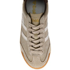 Beige trainer with white stripes on a white background