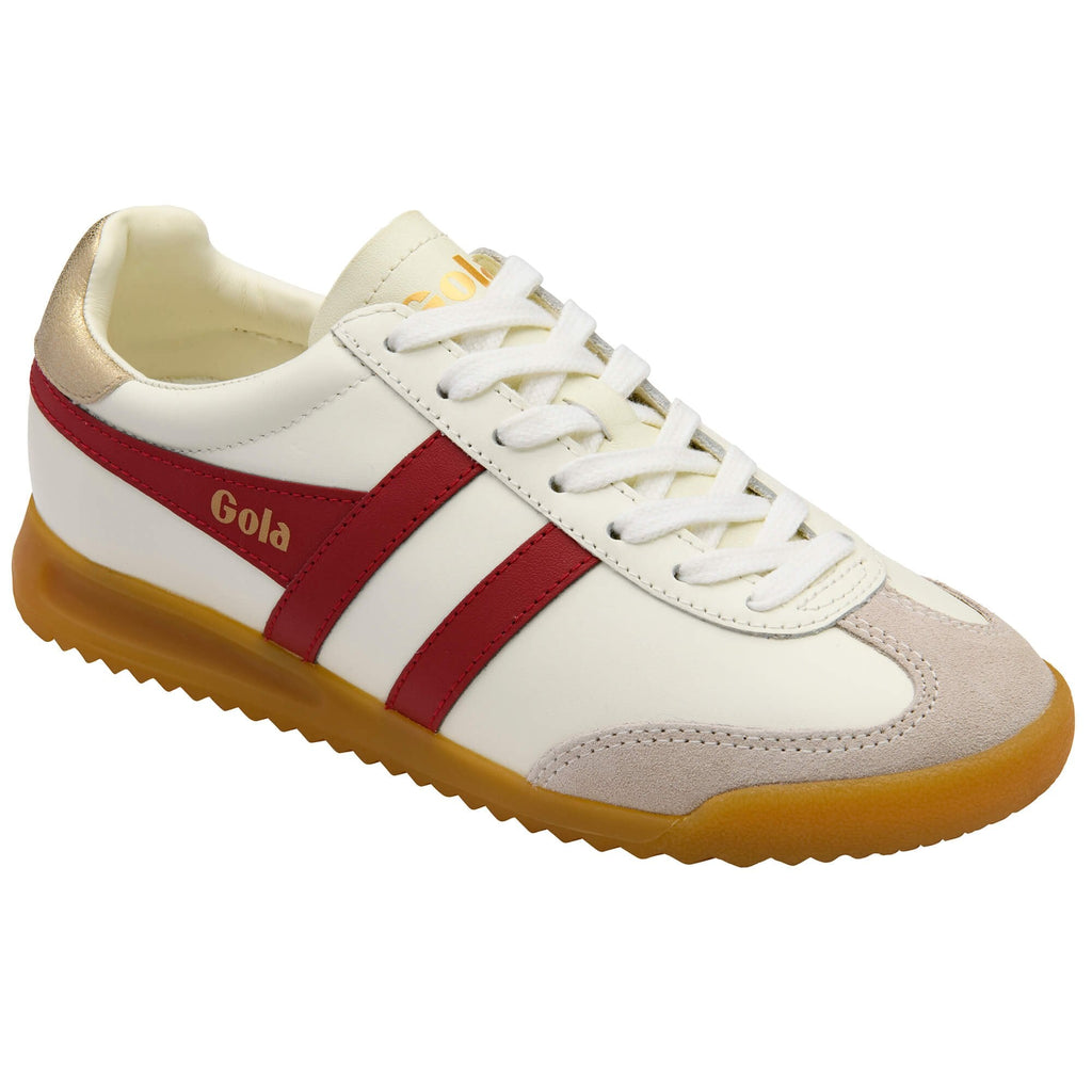 White Gola trainer with red stripe, gold heel tab and gum sole on a white background