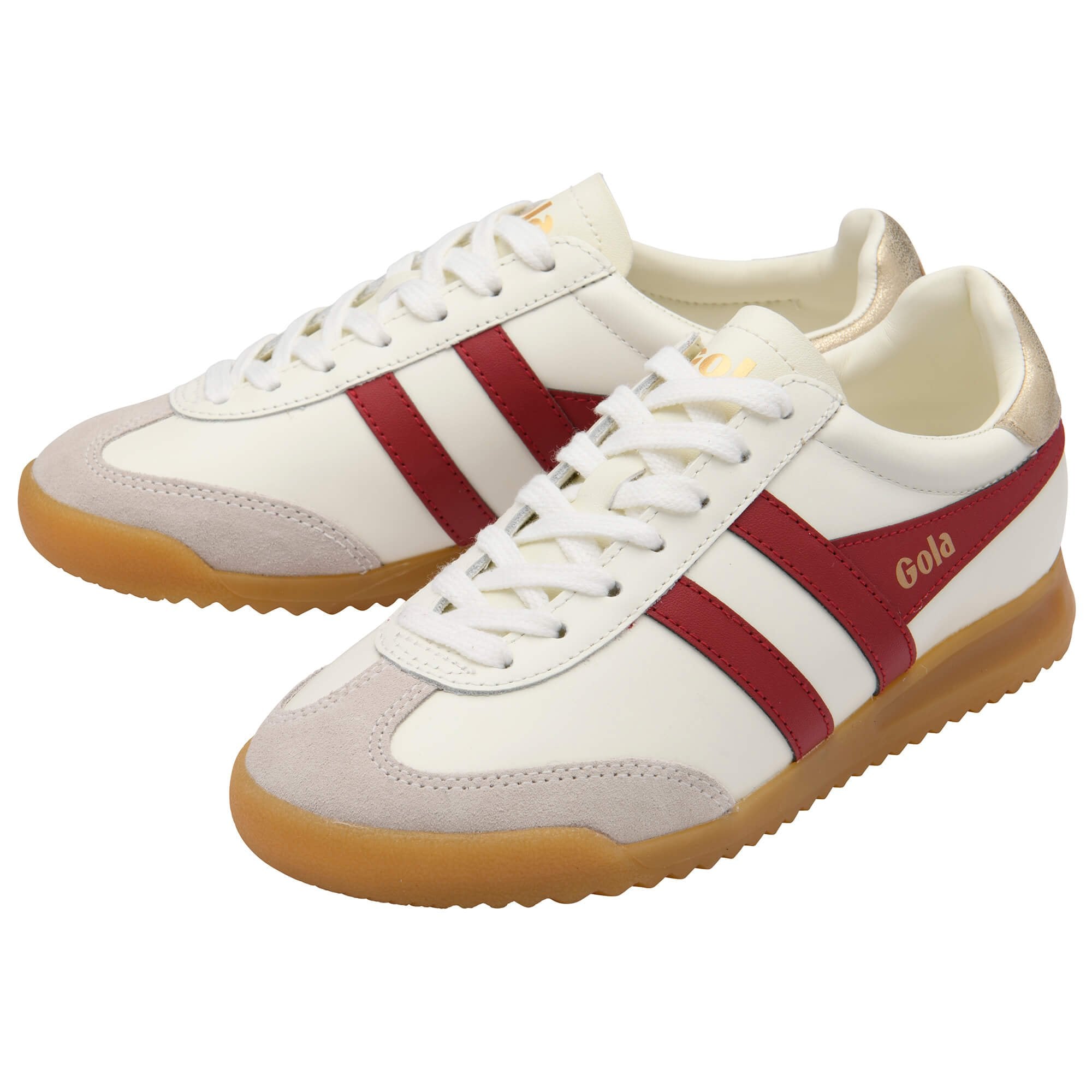 White Gola trainers with red stripes and gum soles on a white background