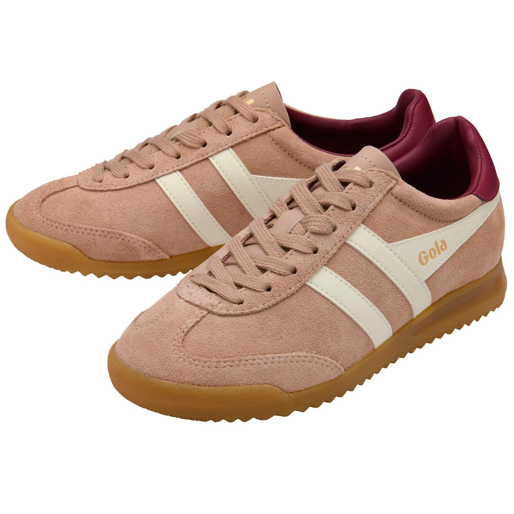 Pair of pink Gola trainers with white stripes and red accents on a white background