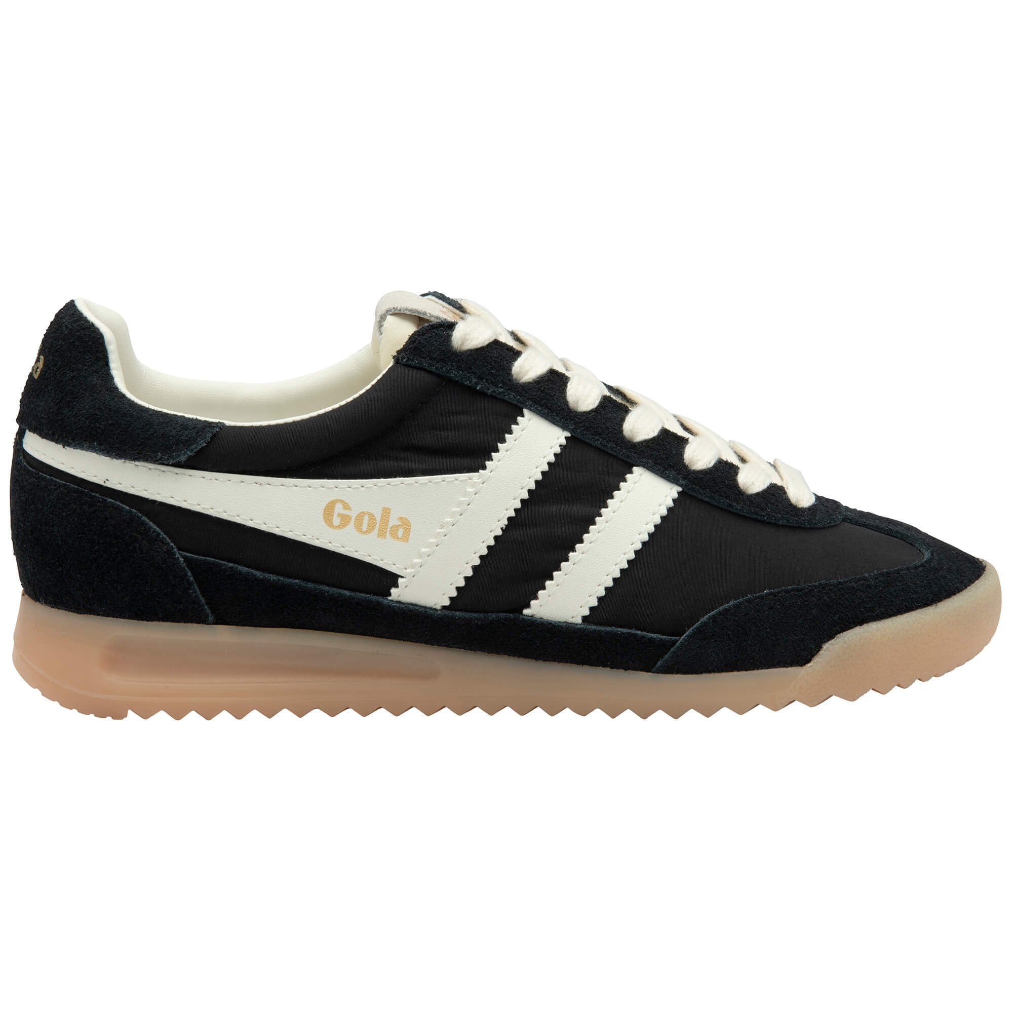 Black and white Gola trainer with a gum sole on a white background