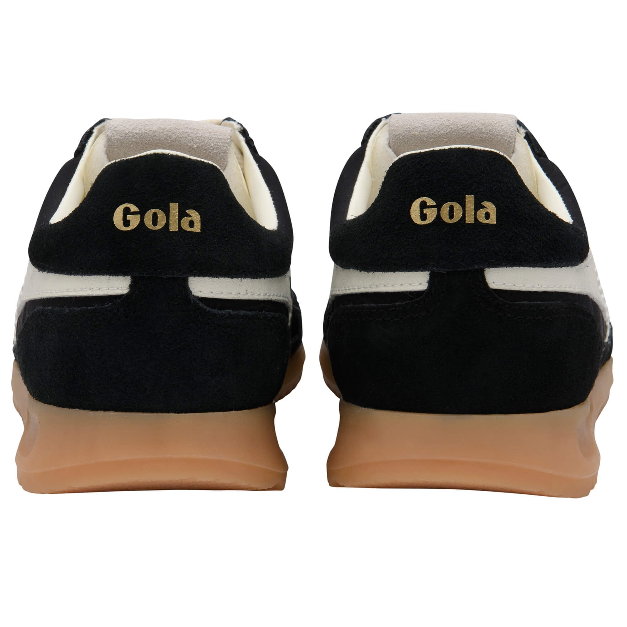 Pair of Gola trainers in black with white trim and gum sole on a white background