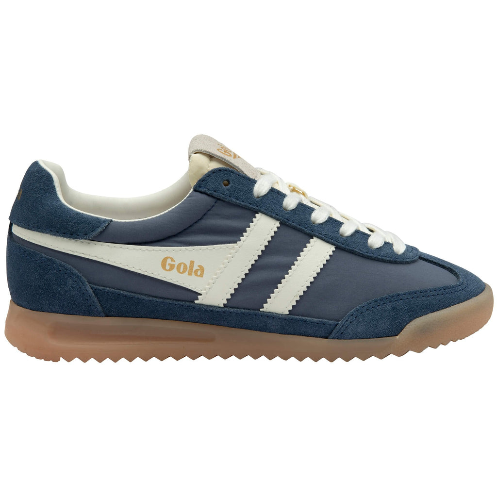 Navy blue and white Gola trainer with gum sole on a white background