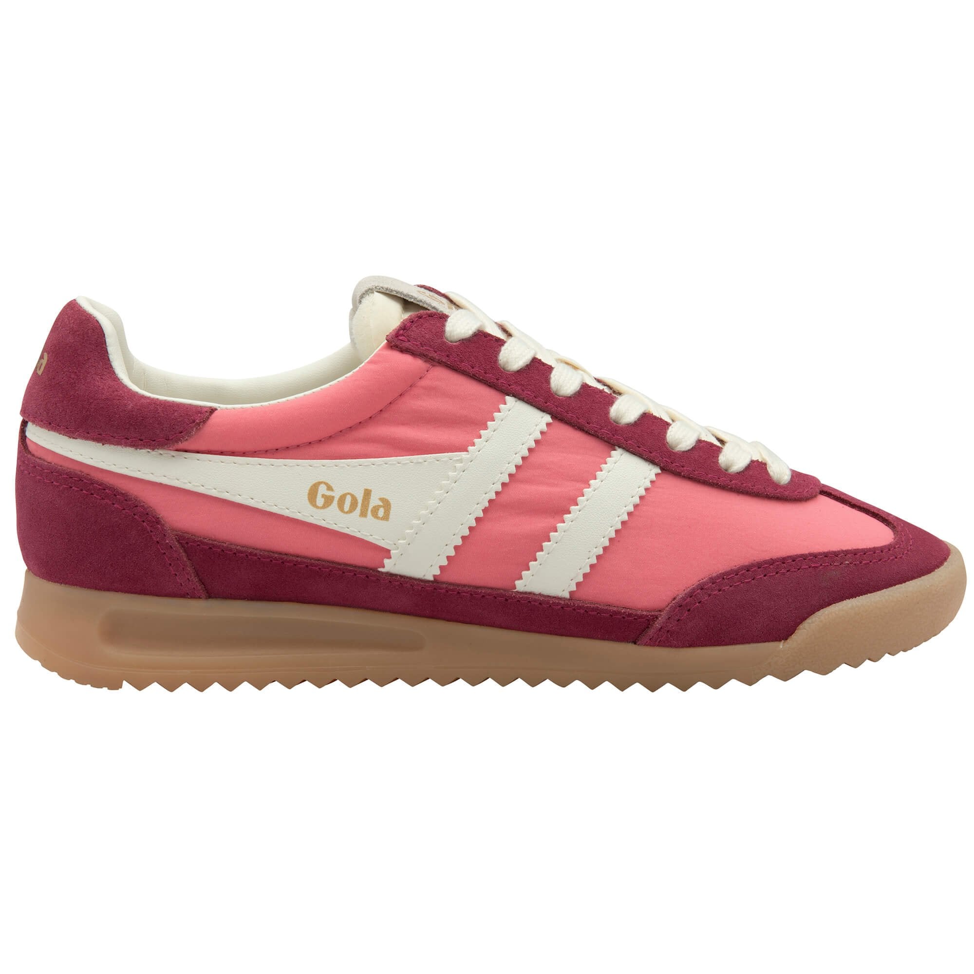 Pink and maroon Gola trainer with white stripes and gum sole on a white background