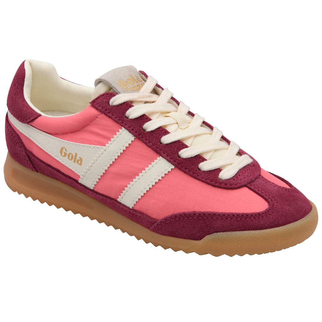 Pink and maroon Gola trainer with white laces and gum sole on a white background
