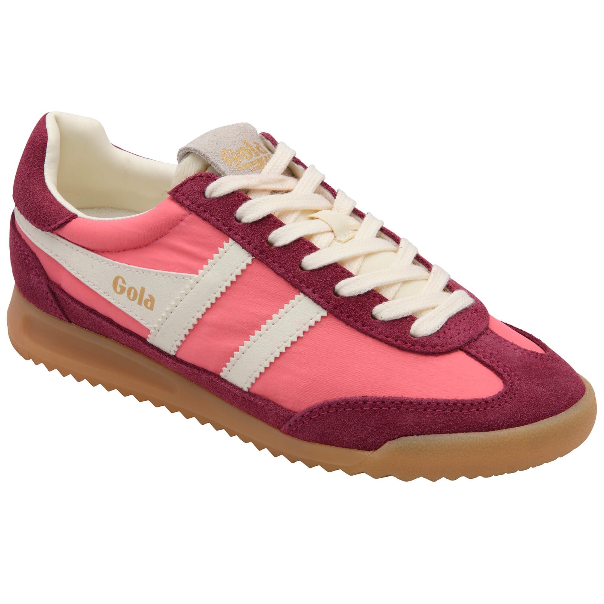 Pink and maroon Gola trainer with white laces and gum sole on a white background