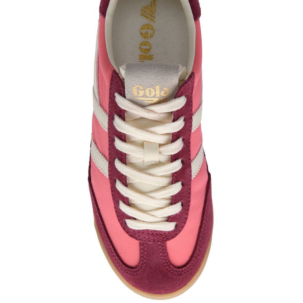 Pink and maroon Gola trainer with white laces on a white background