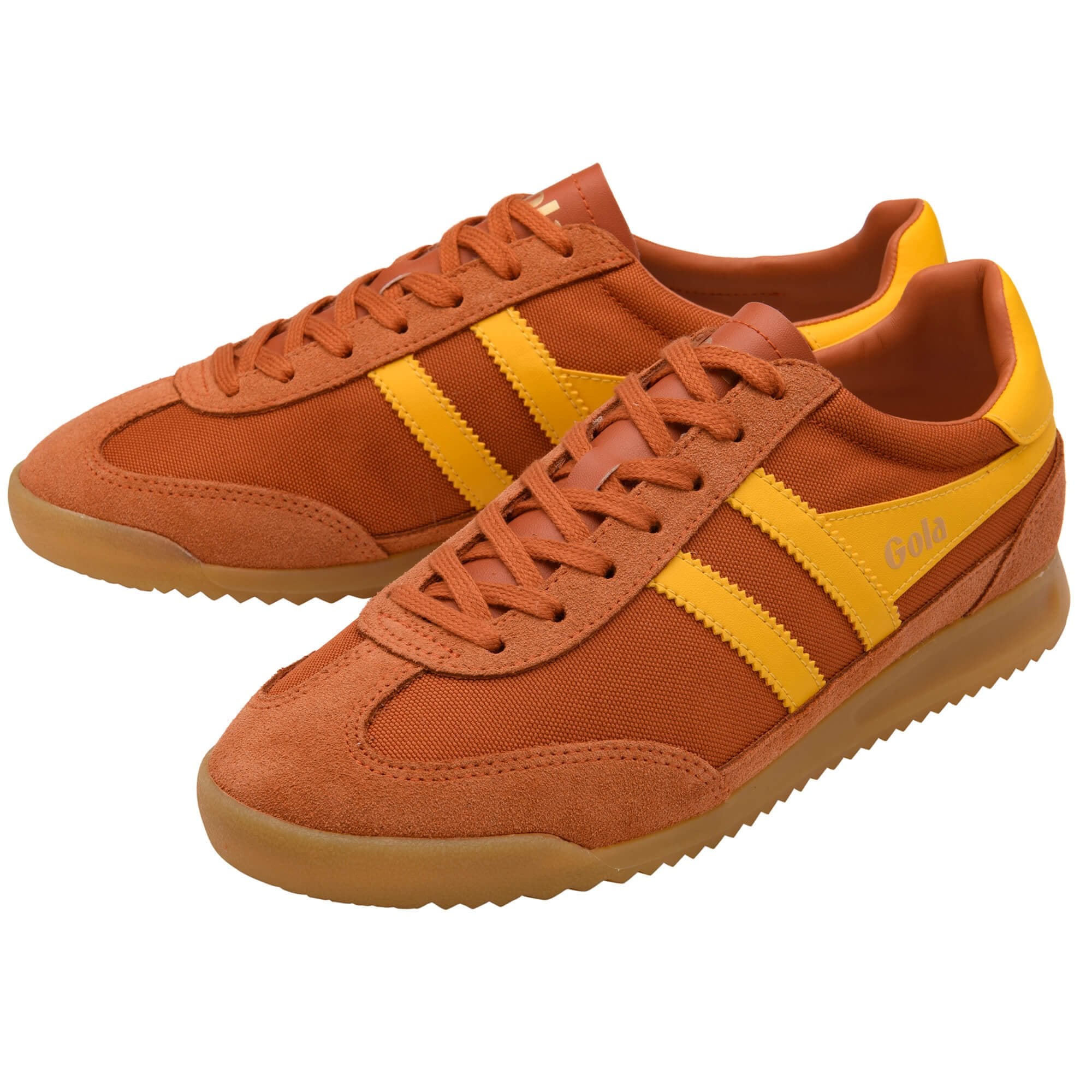 Pair of orange trainers with yellow stripes on a white background