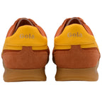 Pair of orange and yellow Gola trainers on a white background