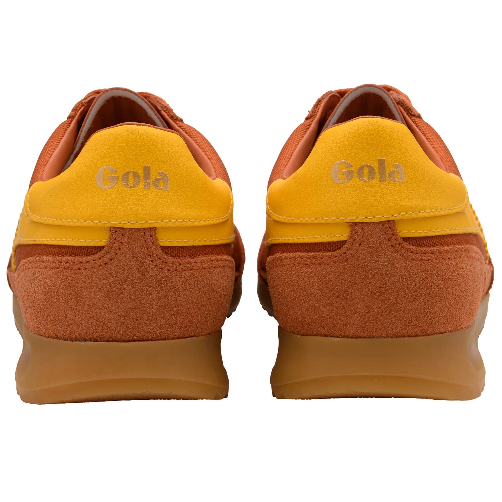 Pair of orange and yellow Gola trainers on a white background