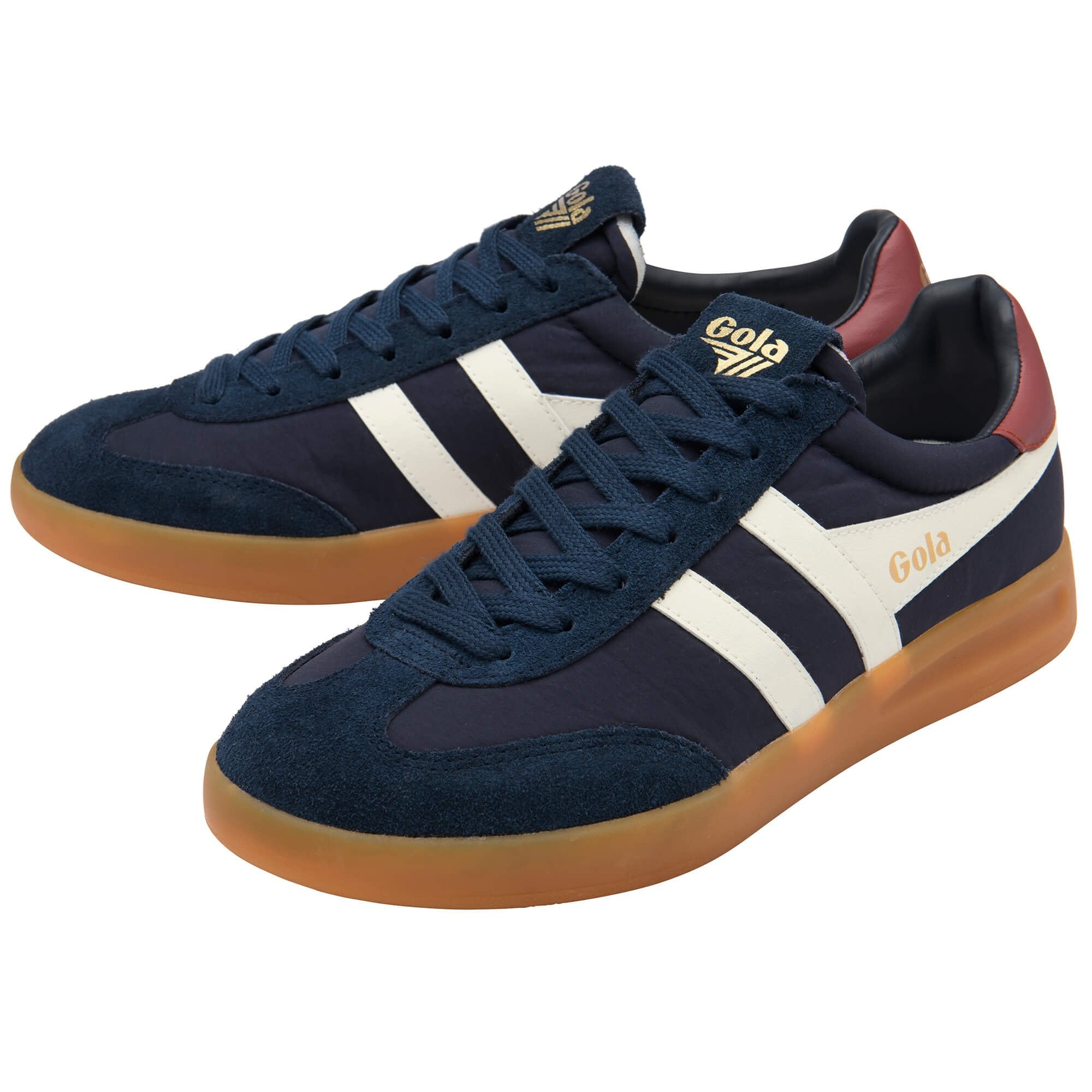 Pair of Gola Harrier trainers in navy with white stripes and a gum sole