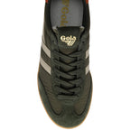 Green Gola trainer with white stripes on a white background