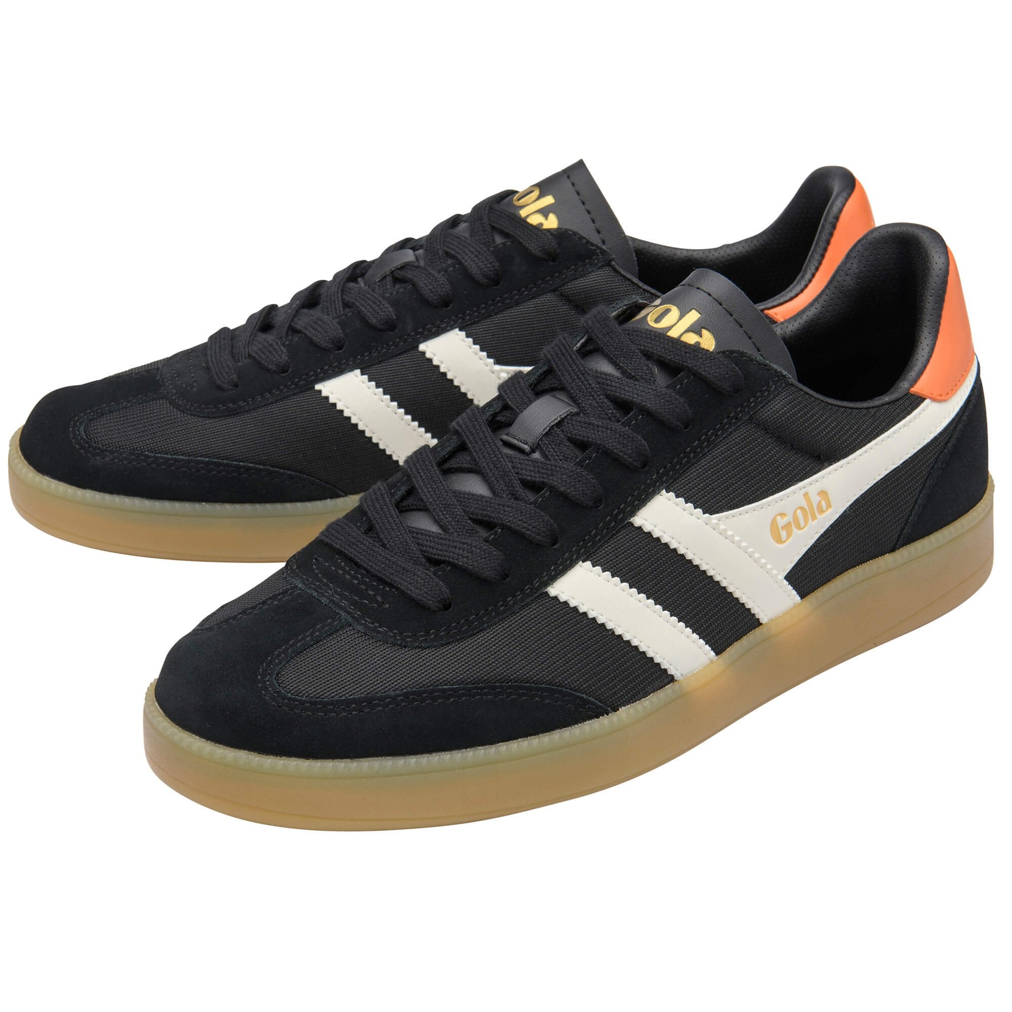 Black trainers with white stripes and orange accents on a white background
