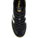 Black trainer with white laces and sole on a white background
