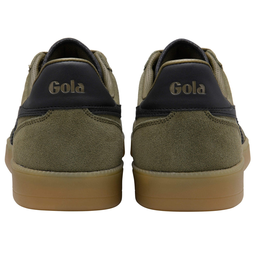 Pair of green Gola trainers with brown soles on a white background