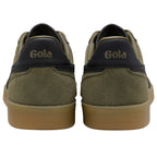 Pair of green Gola trainers with brown soles on a white background
