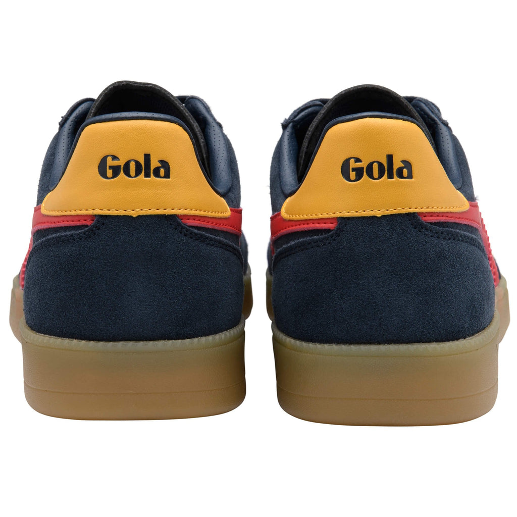 Navy blue trainers with yellow Gola logo on a white background