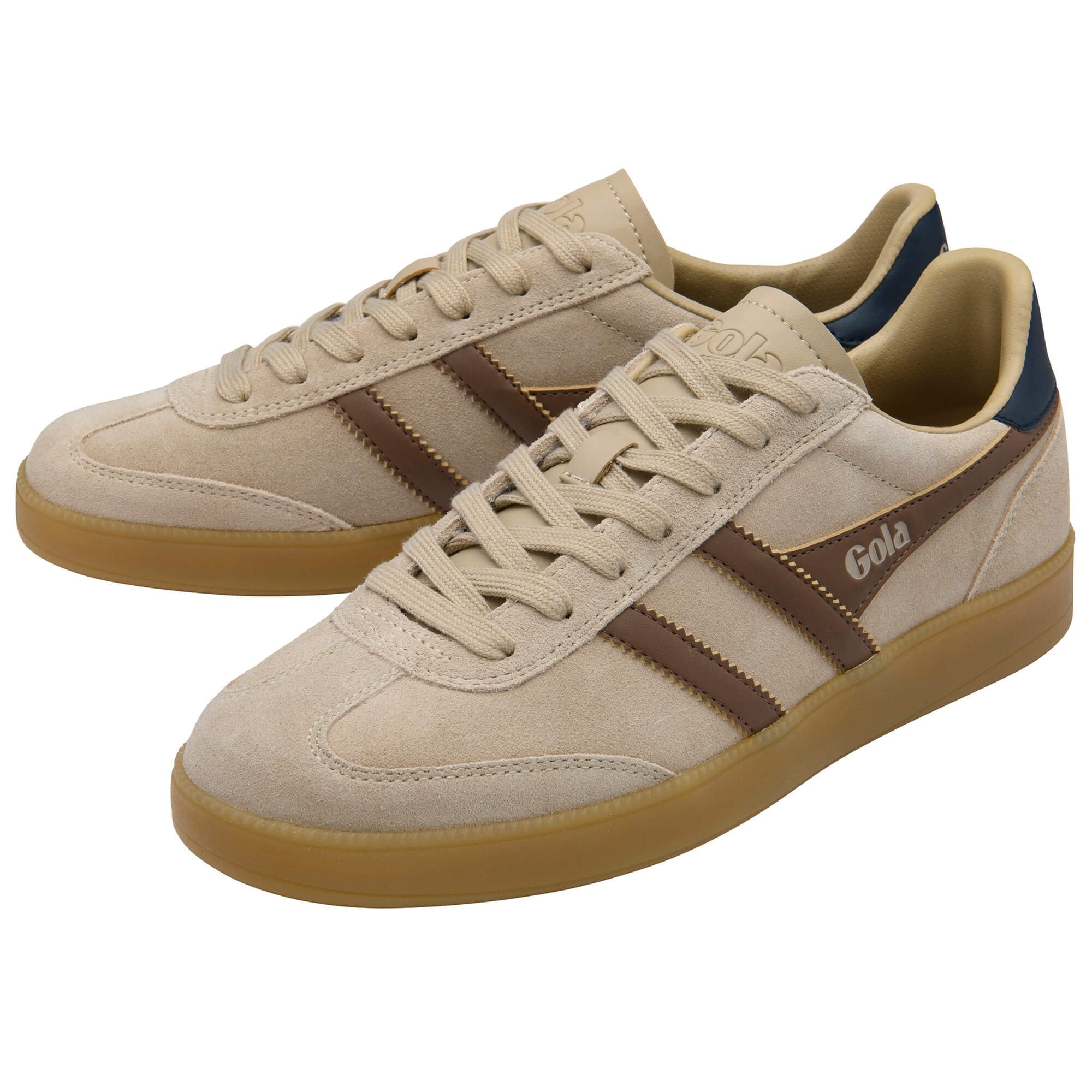 Beige trainers with brown stripes and gum soles on a white background