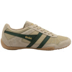 Beige trainer with green stripes on a white background