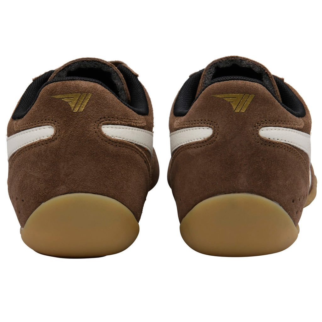 Pair of brown suede shoes with white stripes and a gold logo on the heel