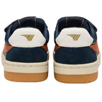Pair of navy, tan, and white trainers with a gold logo on the heel on a white background