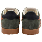 Pair of green suede Gola trainers with dark blue heel tab and brown soles on a white background