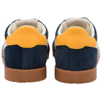 Navy blue children's Gola trainers with yellow heel tabs on a white background