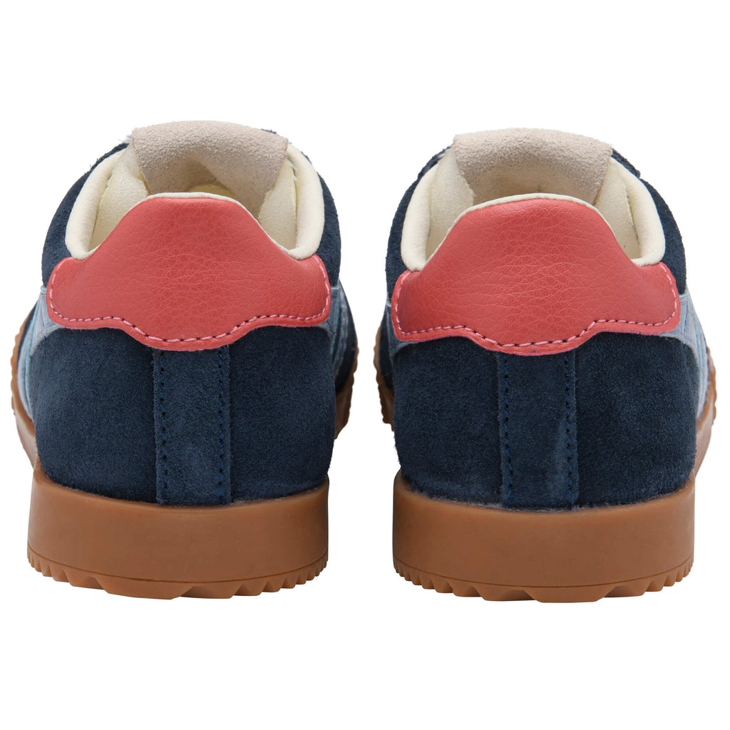 Pair of navy blue suede Gola trainers with red leather heel tabs and brown rubber soles on a white background