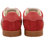 Pair of red Gola trainers with brown soles on a white background