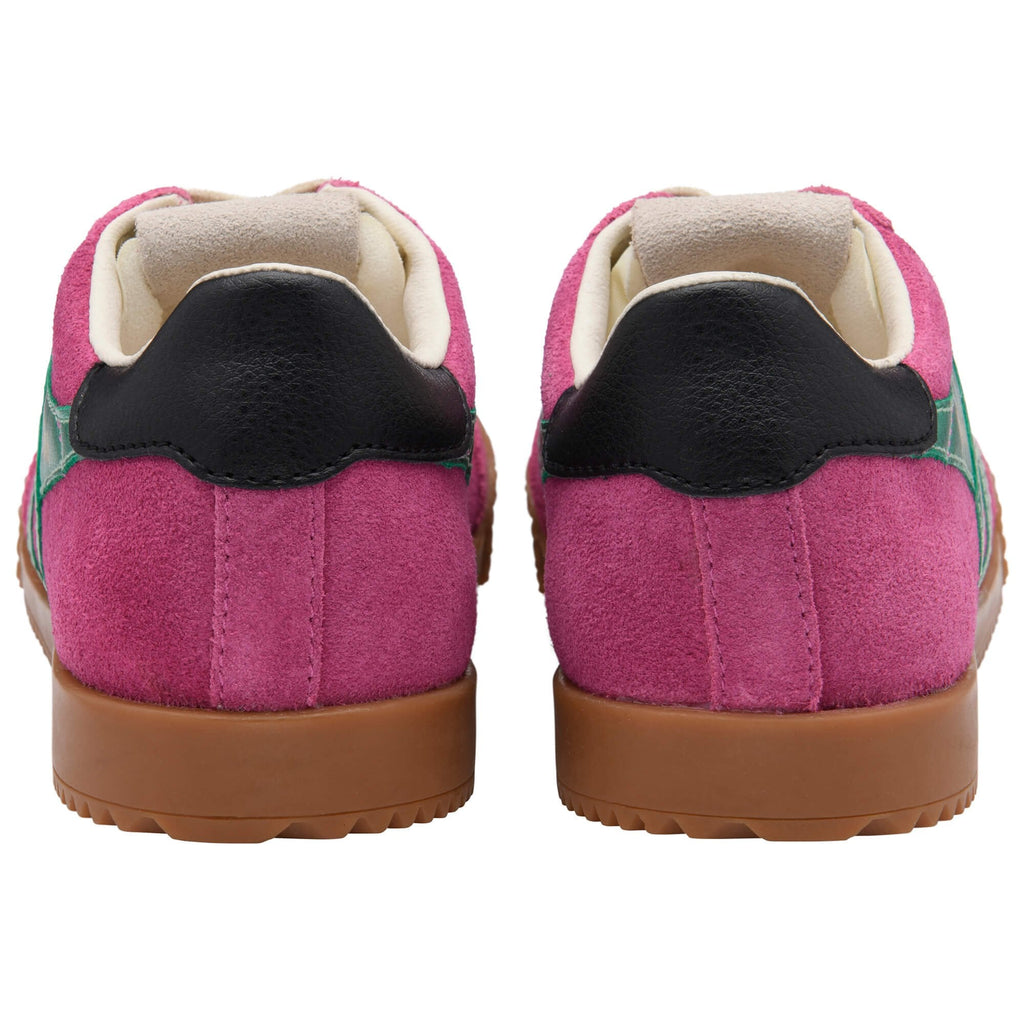 Pink Gola trainer with a brown sole on a white background