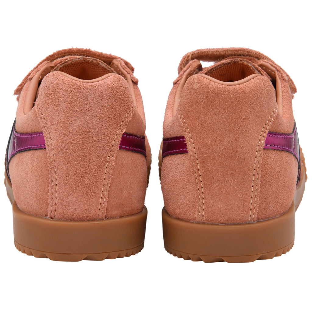 Pair of pink Gola trainers with brown soles on a white background
