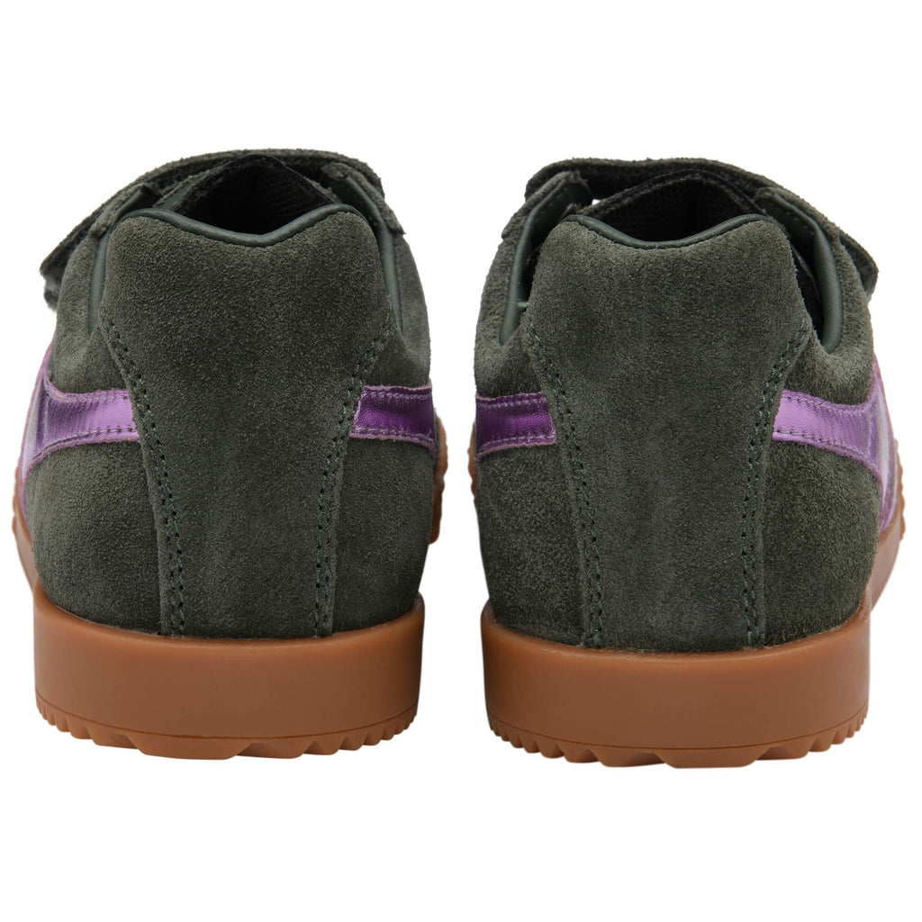 Green Gola trainers with purple accents on a white background