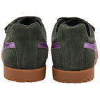 Green Gola trainers with purple accents on a white background