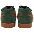 Green suede Gola trainers with brown soles on a white background